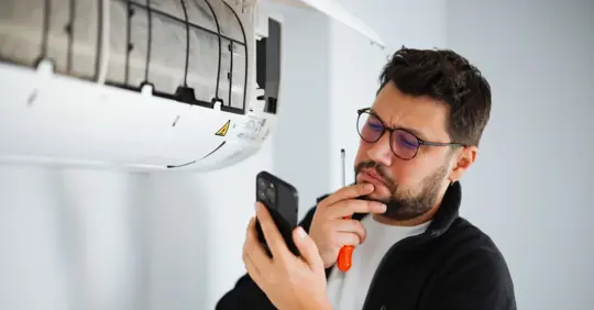 Man about to call HVAC services